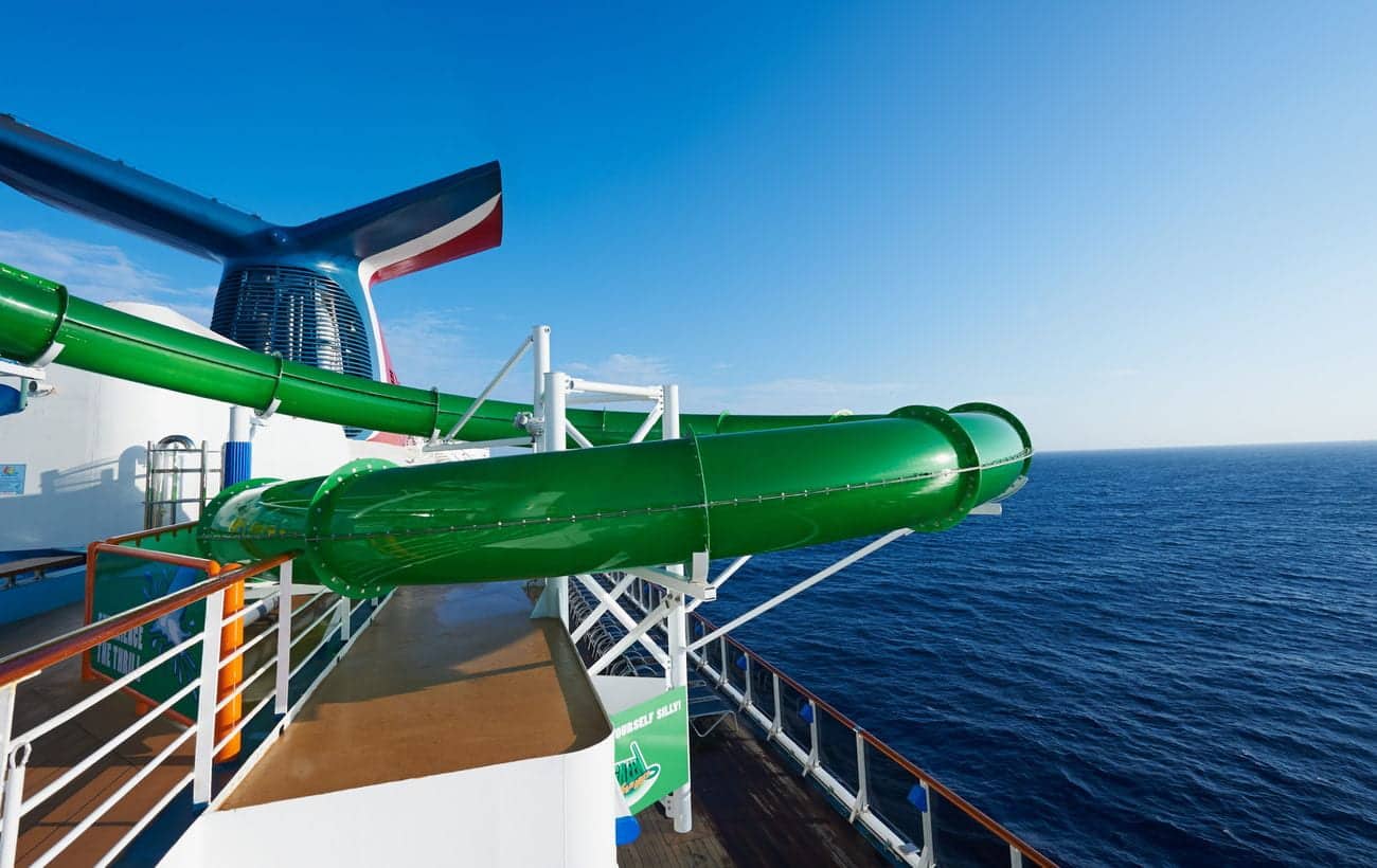 Carnival Pride WaterWorks green waterslide overlooking the ocean
