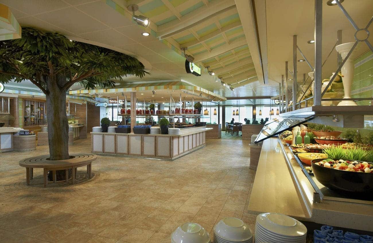 Carnival Sunshine Lido Marketplace buffet with fresh options, tree centerpiece, and casual seating