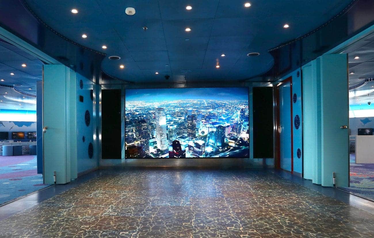 Camp Ocean play area with a large digital wall screen and blue interior