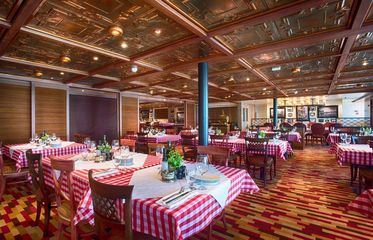 Italian restaurant with checkered tables and paneled ceiling