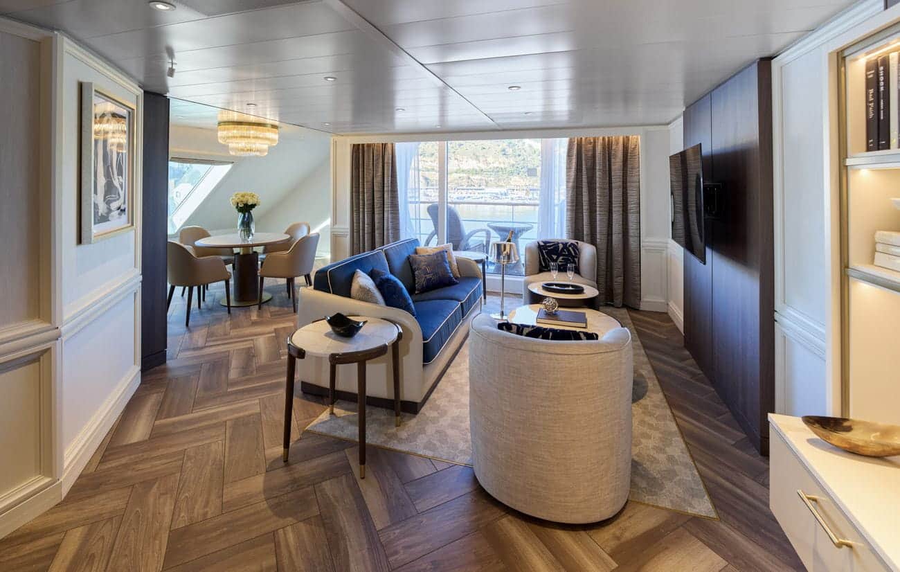 Spacious Regent cruise ship grand suite living room with balcony view