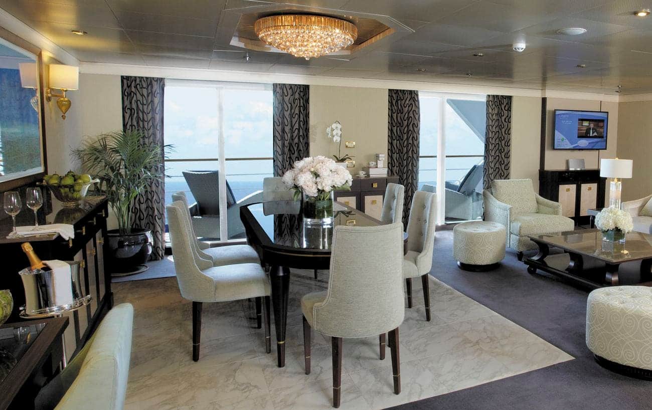 Signature Suite living and dining area with balcony