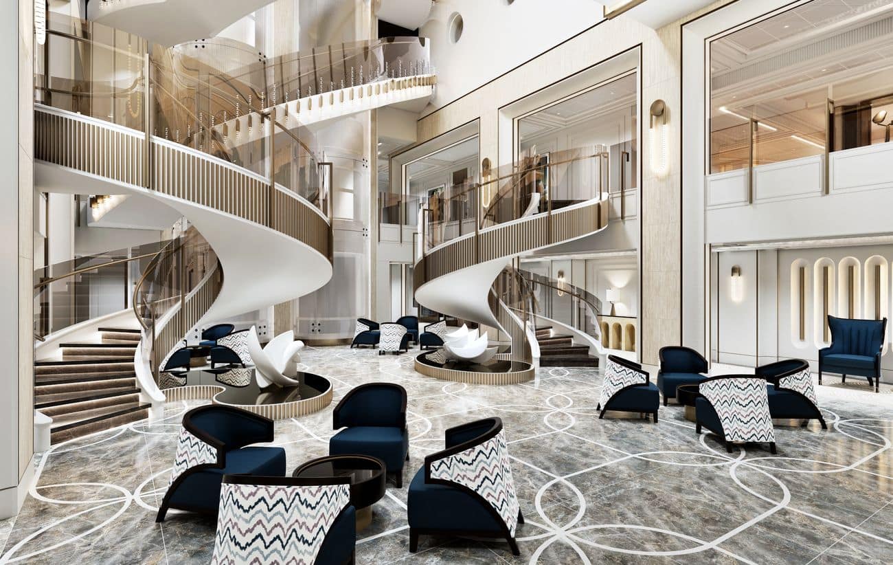 Seven Seas Prestige Starlight Atrium with sweeping spiral staircases, marble flooring and contemporary lounge seating