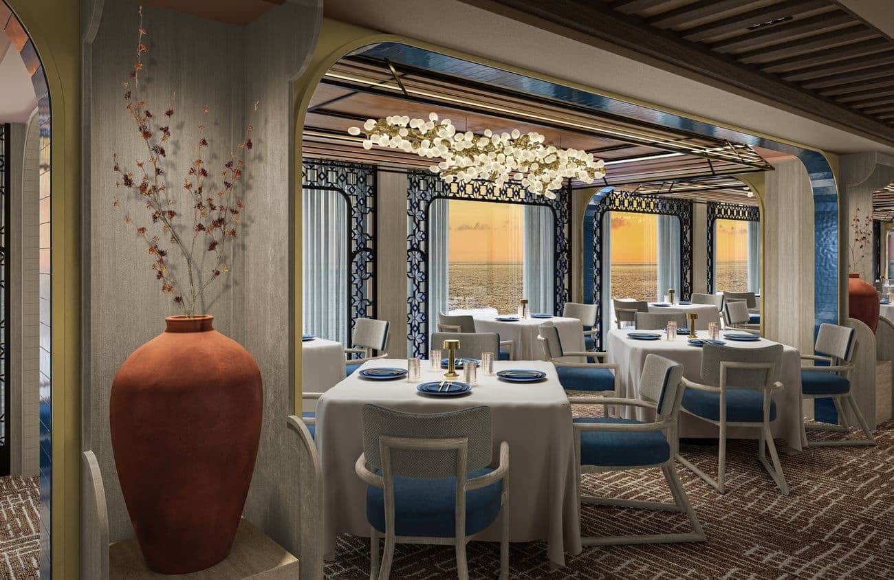 Azure Mediterranean specialty restaurant with ocean-view windows, elegant tables and contemporary lighting