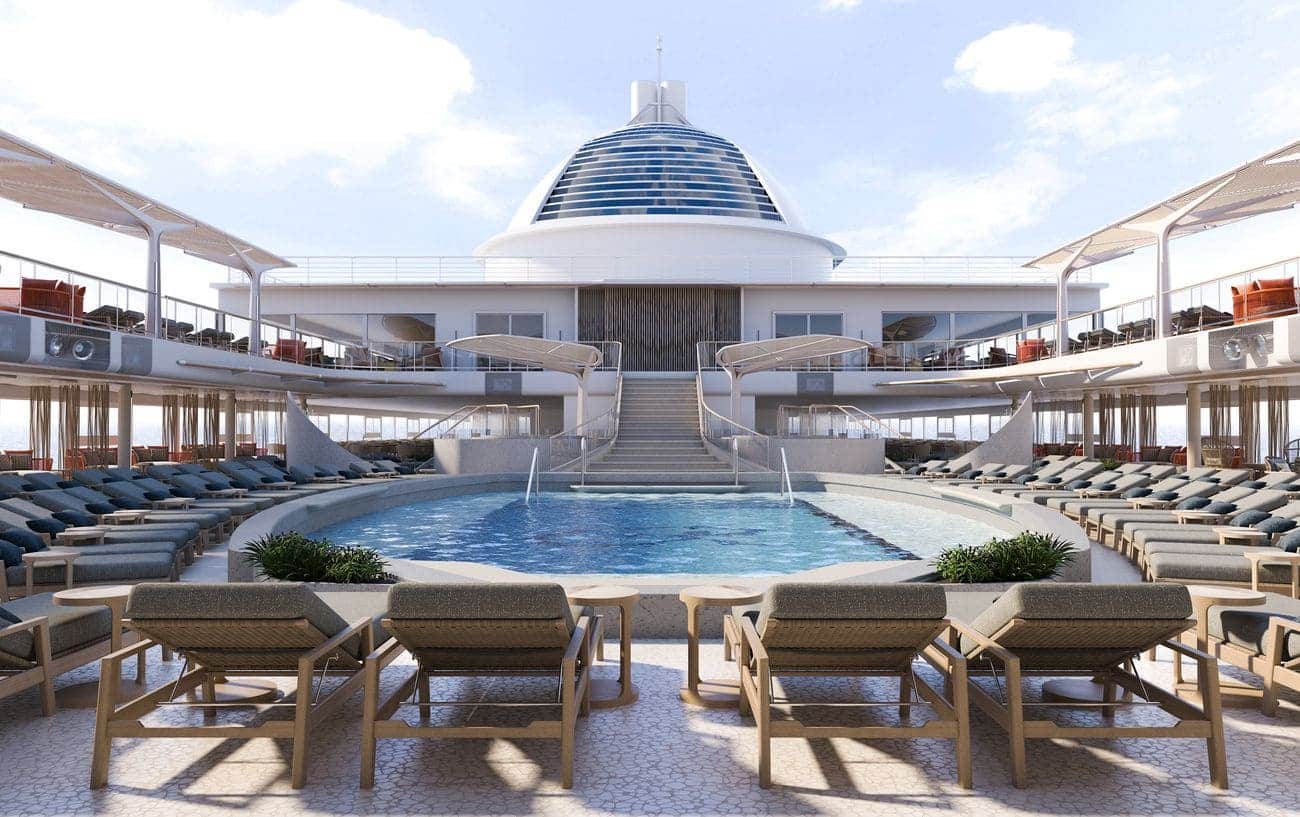 Luxury pool deck aboard Seven Seas Prestige with central swimming pool surrounded by sun loungers and shaded terraces
