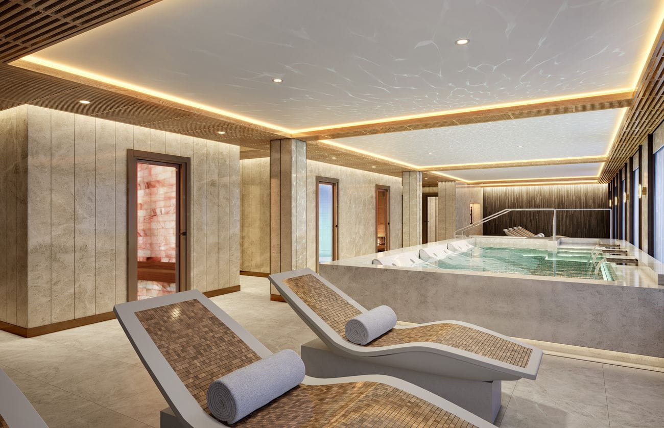 Serene cruise ship spa relaxation area with heated loungers, whirlpool and softly lit wellness spaces