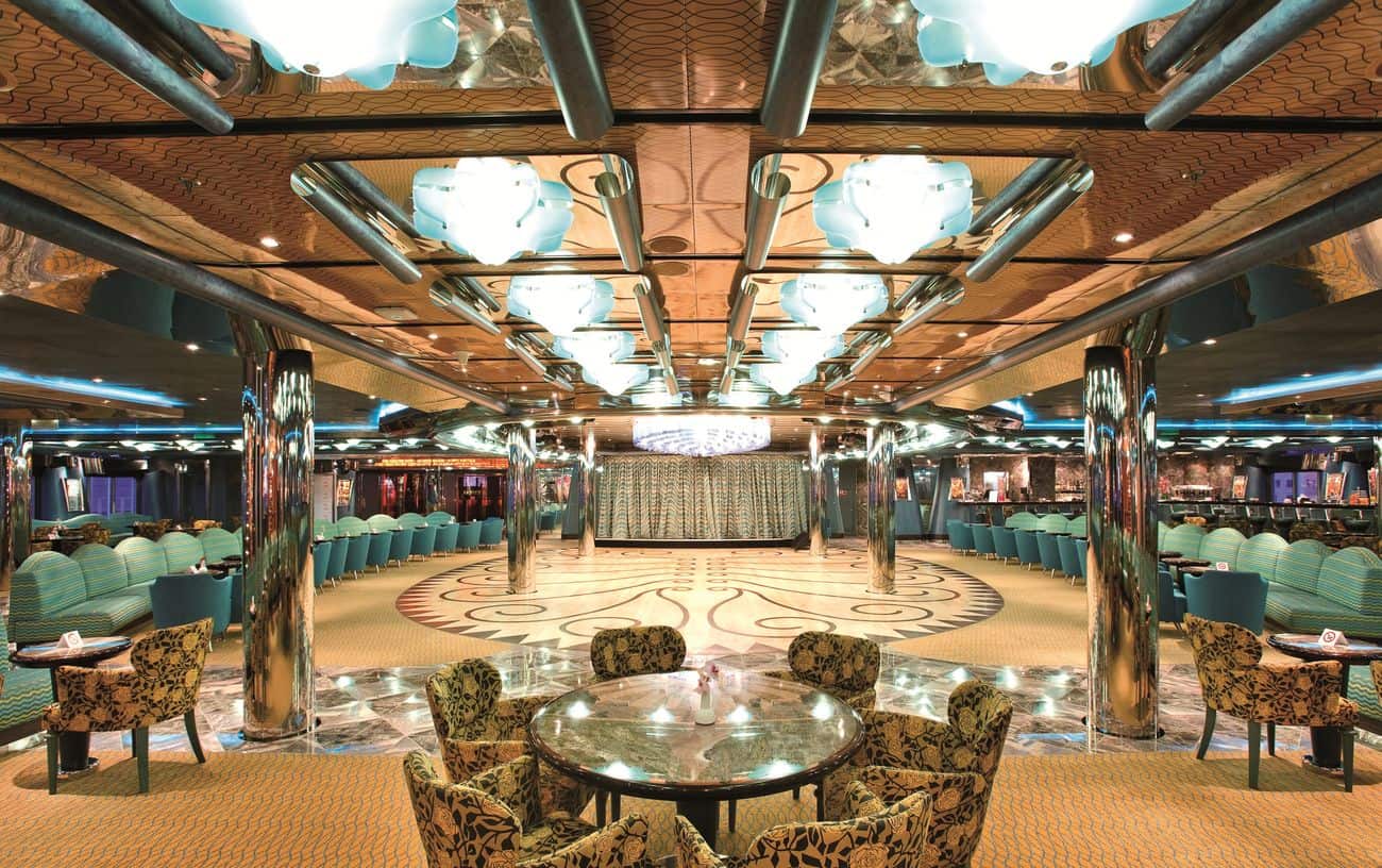 Grand Bar Mirabilis lounge with turquoise seating and central dance floor