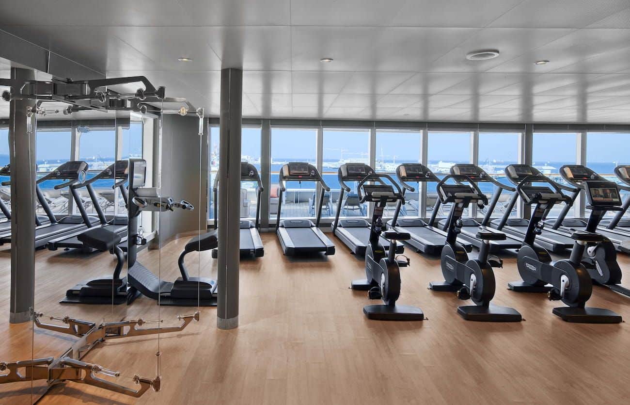 Fitness Center with treadmills, bikes, weights, and ocean views