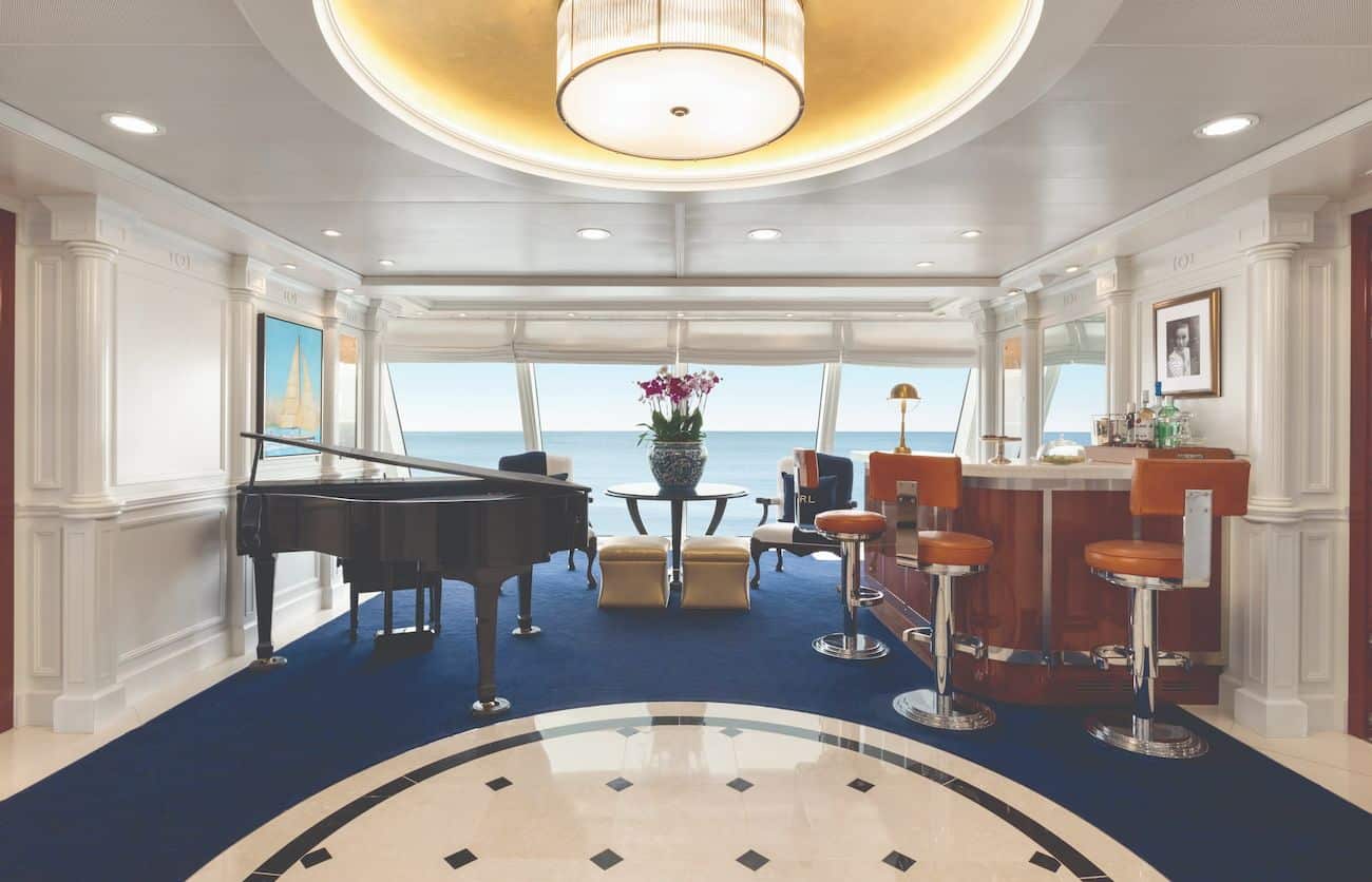 Owner’s Suite Foyer with piano, bar seating, and ocean views