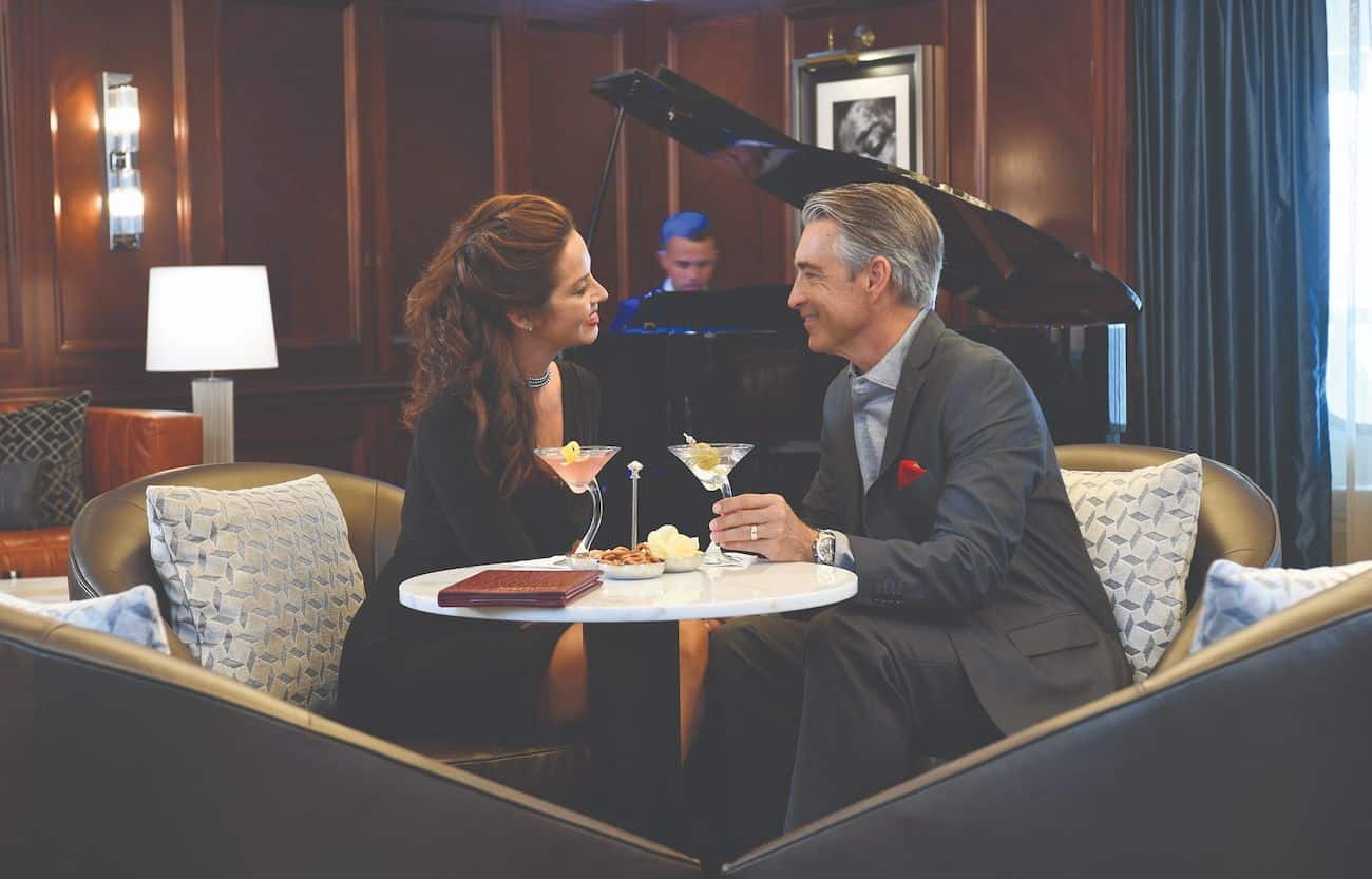 Martinis Piano Bar lounge with guests enjoying cocktails and live piano music