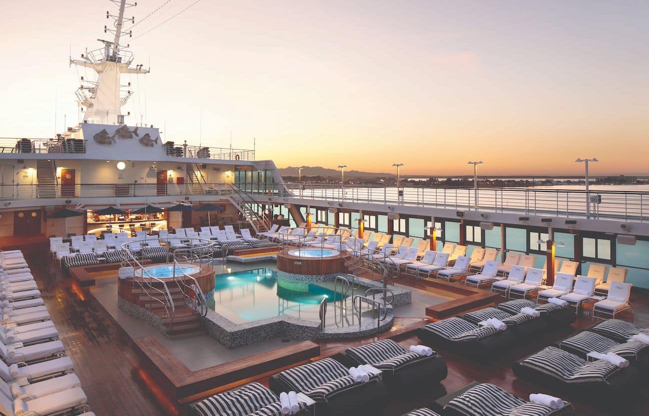 Oceania Regatta Pool Deck with loungers at sunset