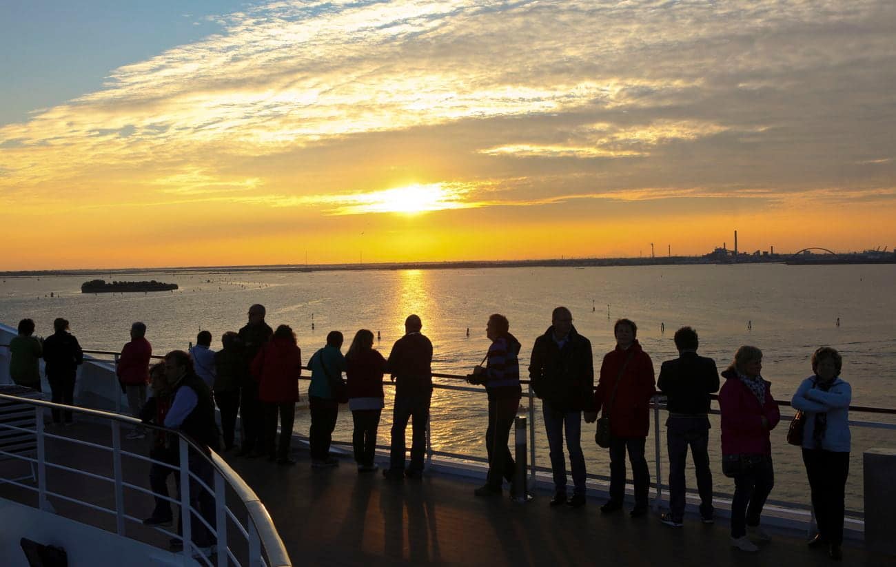 Guests watching sunset during Venice departure