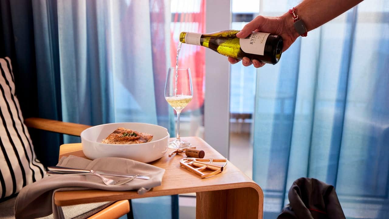 Virgin Voyages Valiant Lady cabin dining with wine service