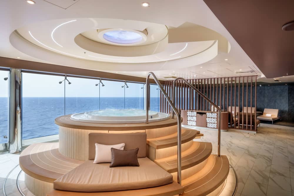 Ocean-facing whirlpool and relaxation area inside the enhanced MSC Aurea Spa