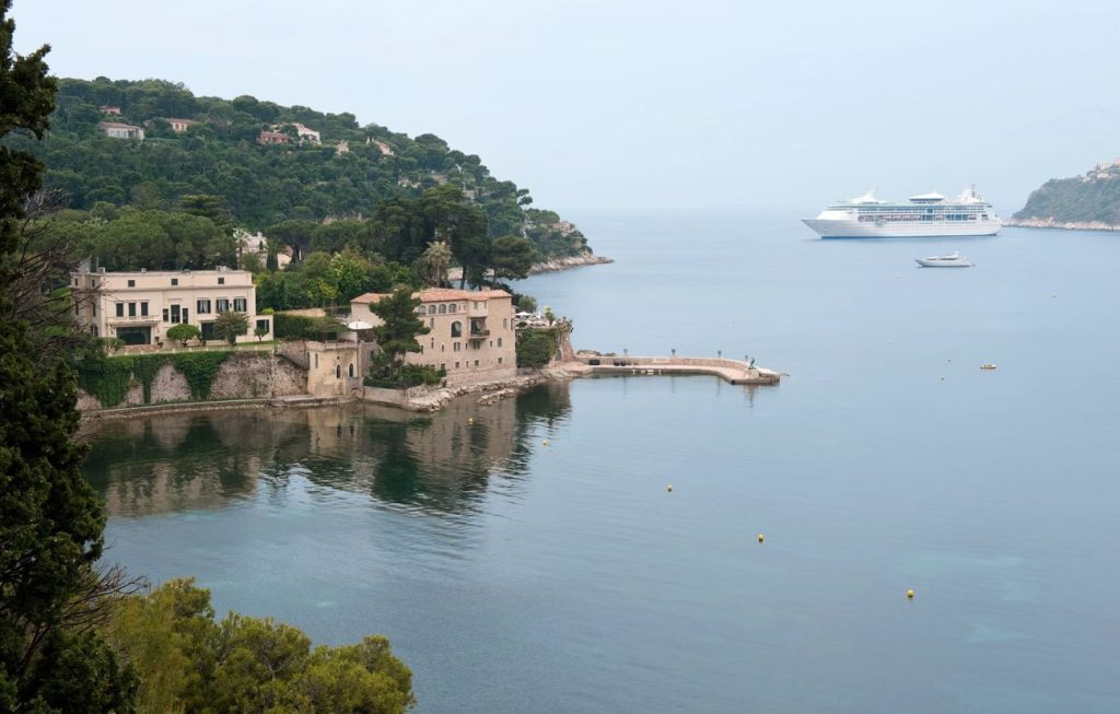 Grandeur of the Seas anchored off Villefranche-sur-Mer on Mediterranean cruises in 2026