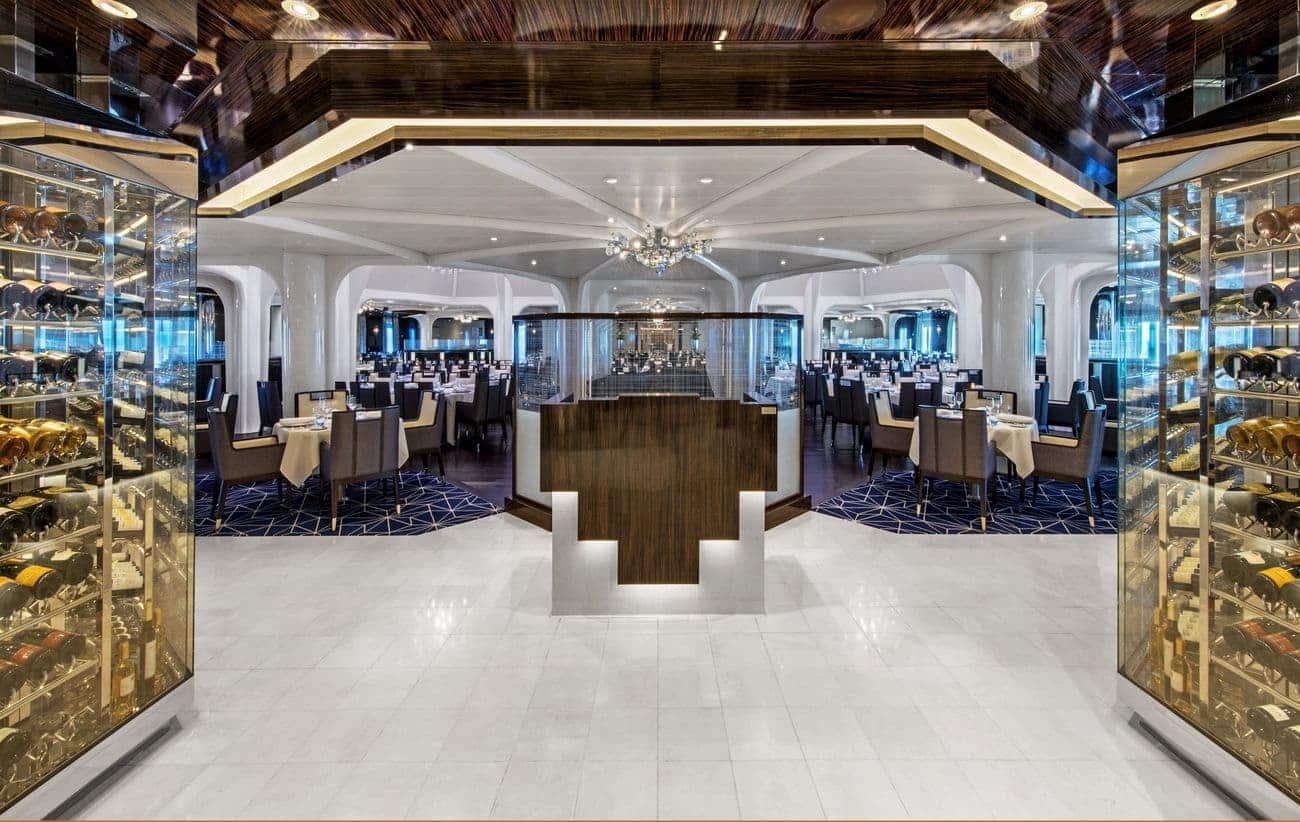The Restaurant aboard Seabourn Ovation with wine displays and elegant dining tables
