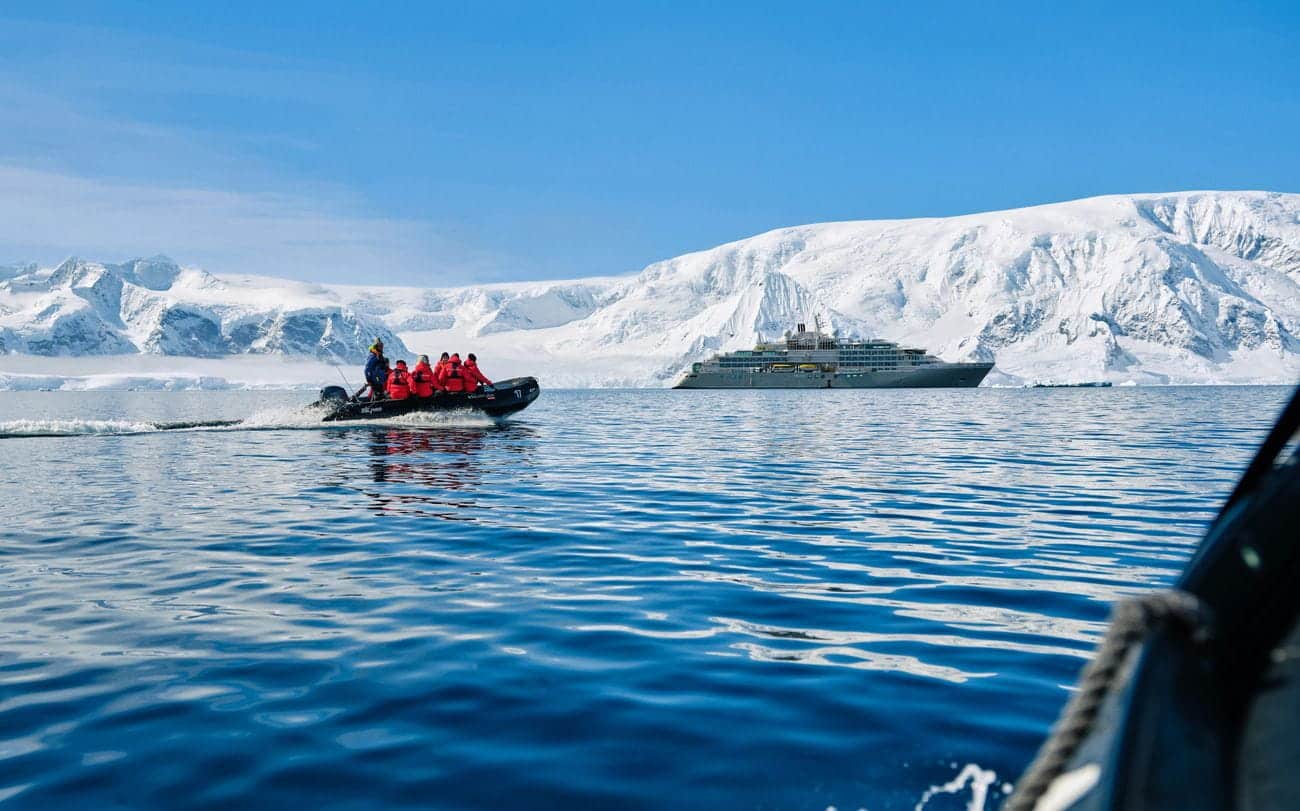Zodiac excursion approaching Silver Endeavour in Wilhelmina Bay, Antarctica