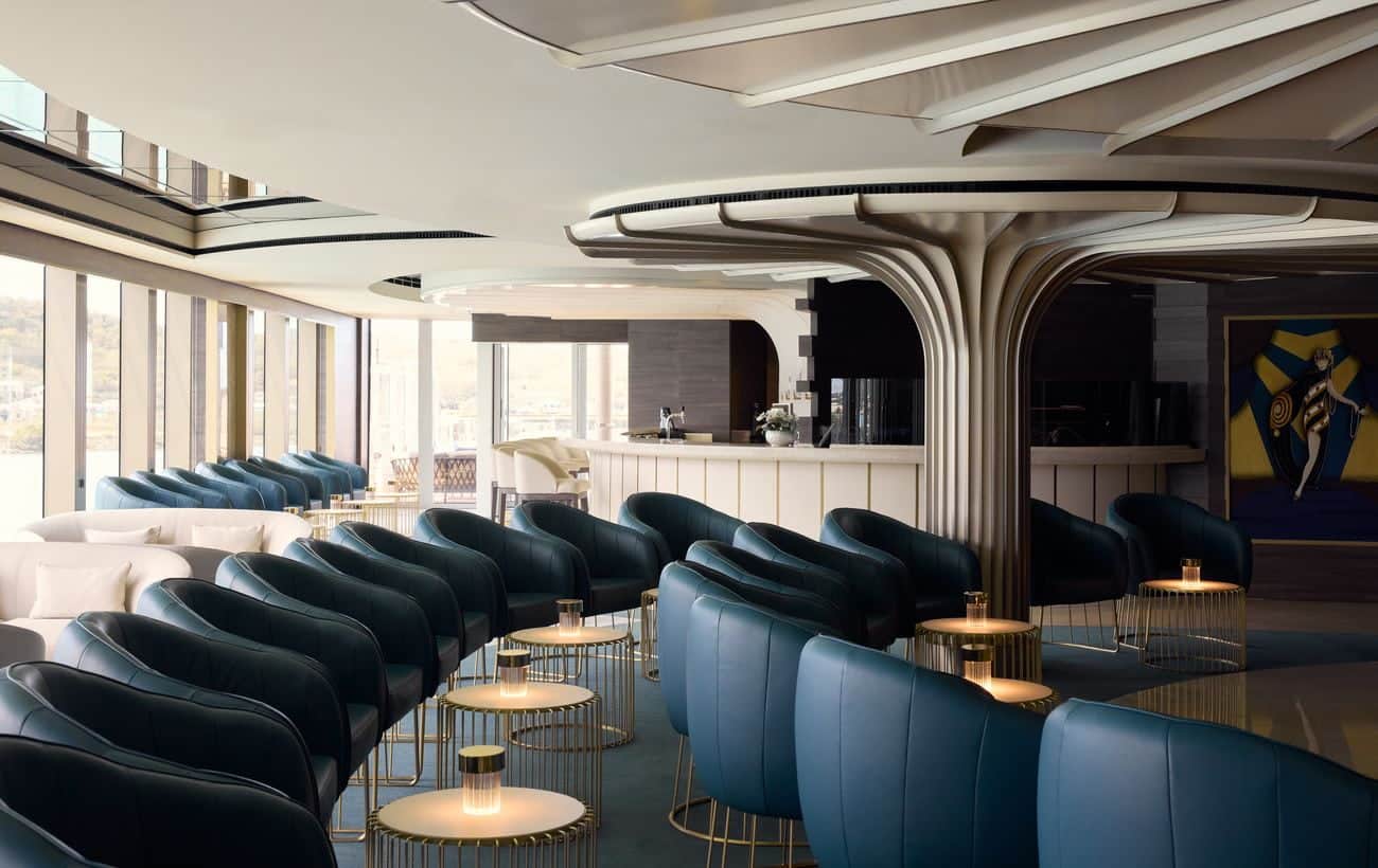 Astern Lounge with curved architecture and blue armchairs
