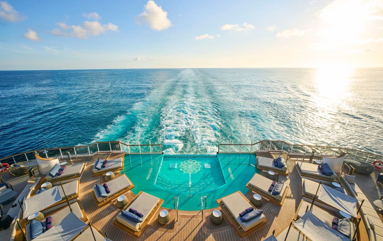 Astern Pool aboard an Explora Journeys ship at sunset