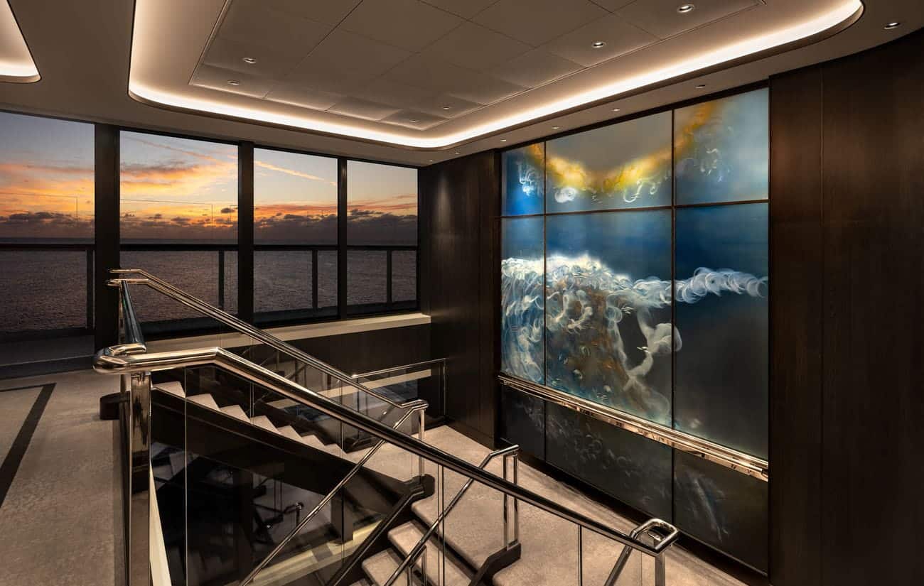 Aft stairwell with illuminated contemporary artwork and ocean views