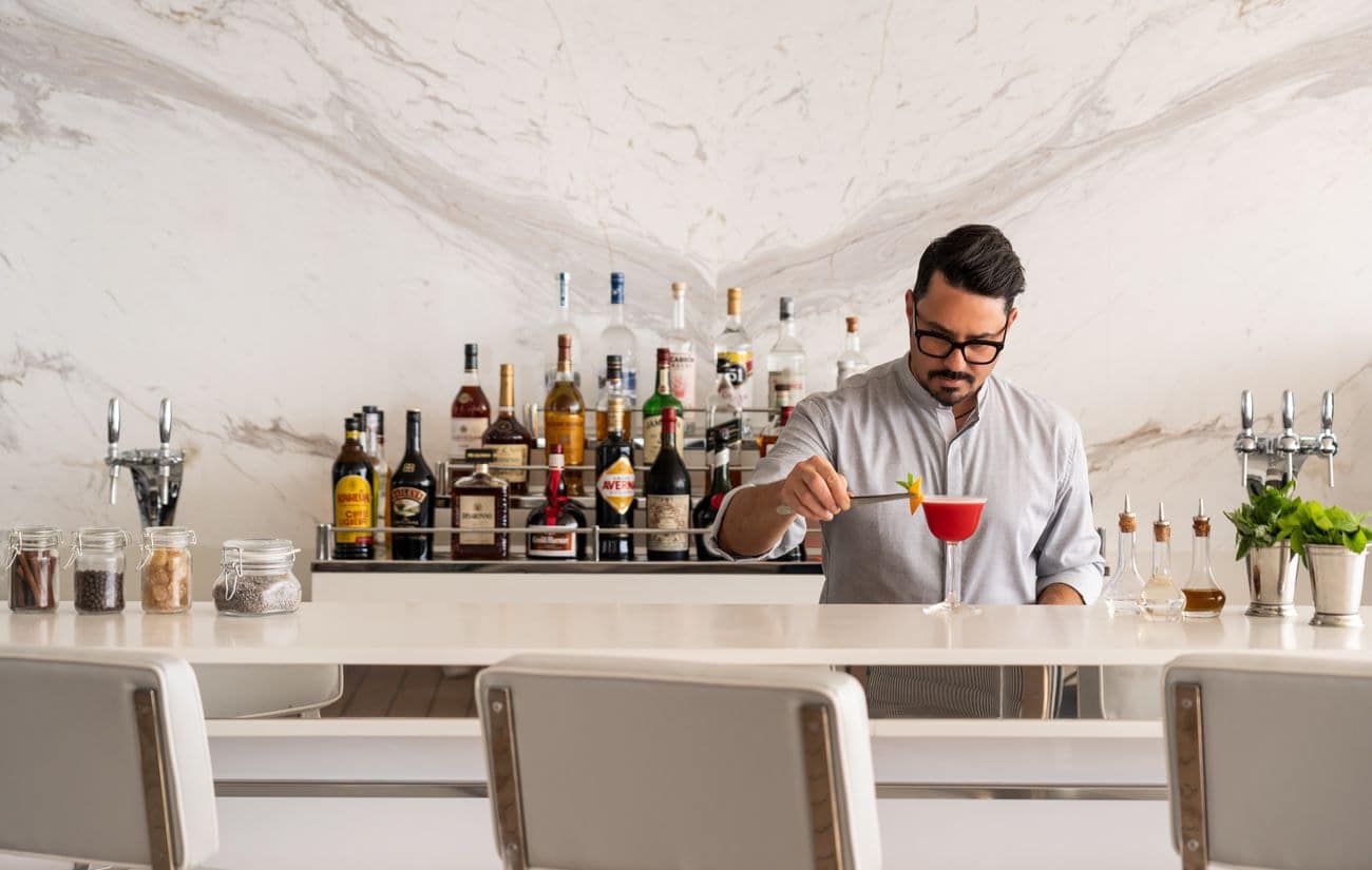Bartender preparing a cocktail at Mistral Bar on Ilma