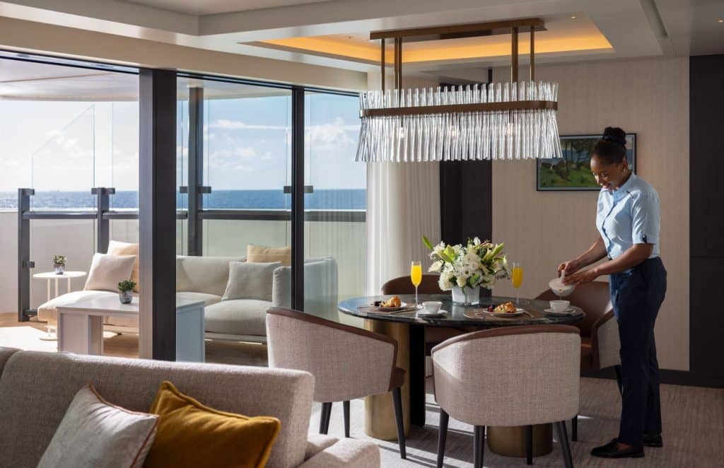 In-suite breakfast service aboard Ilma with ocean views from the terrace