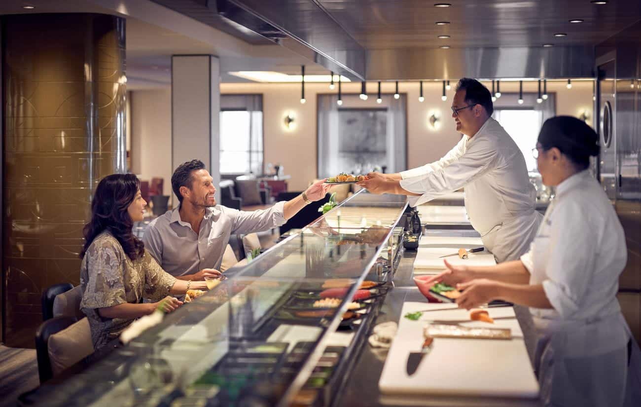 Haesu Bit sushi chefs serving guests at the counter
