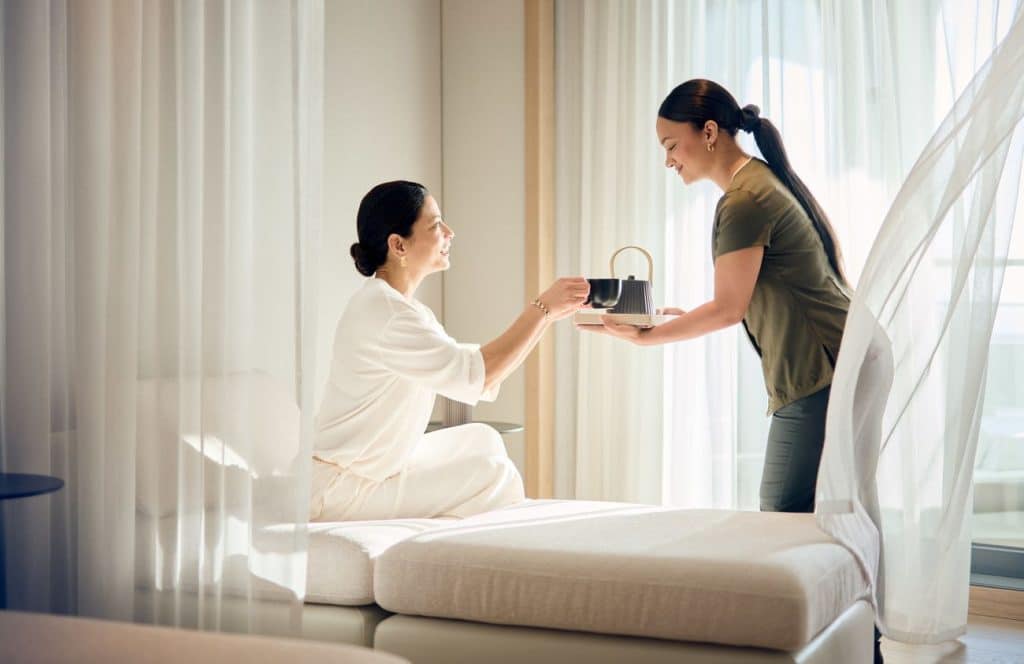 Guest receiving service in the Relaxation Room aboard Luminara